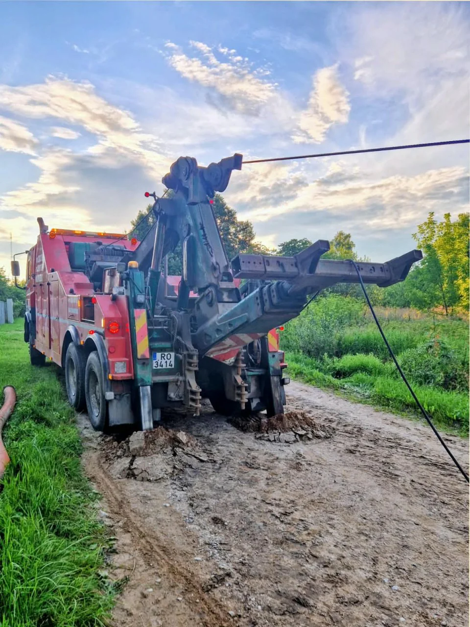 Heavy tow truck on a muddy road